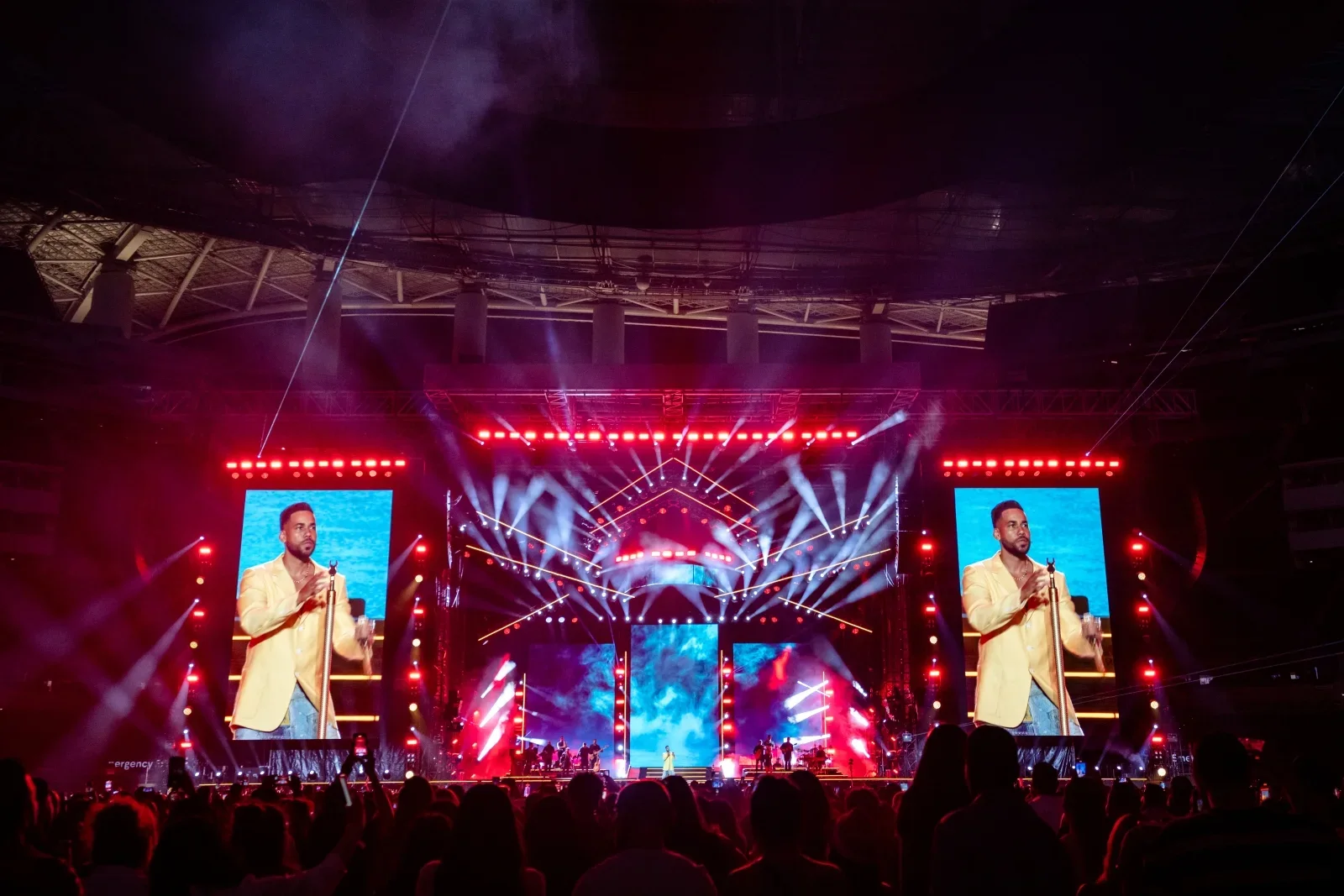 A Romeo Santos arena stage viewed from the front-of-house control position.